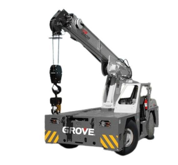 The image shows a gray Grove YB4409 carry deck crane. The crane features a telescoping boom, which is partially extended and equipped with a hook for lifting loads. The crane is mounted on a compact, wheeled chassis for enhanced mobility. The deck of the crane is designed to carry loads, and the word "GROVE" is prominently displayed on the front of the crane.