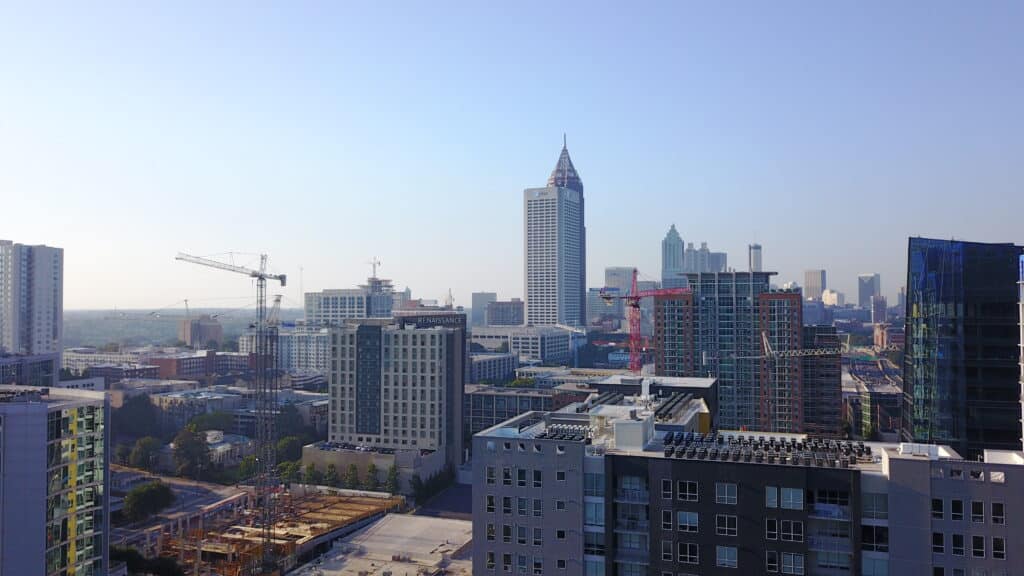 Tower cranes working within a city. Skyline view