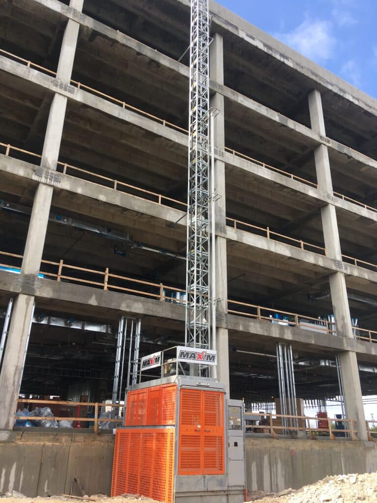 Maxim Crane personnel hoist at the bottom of a building
