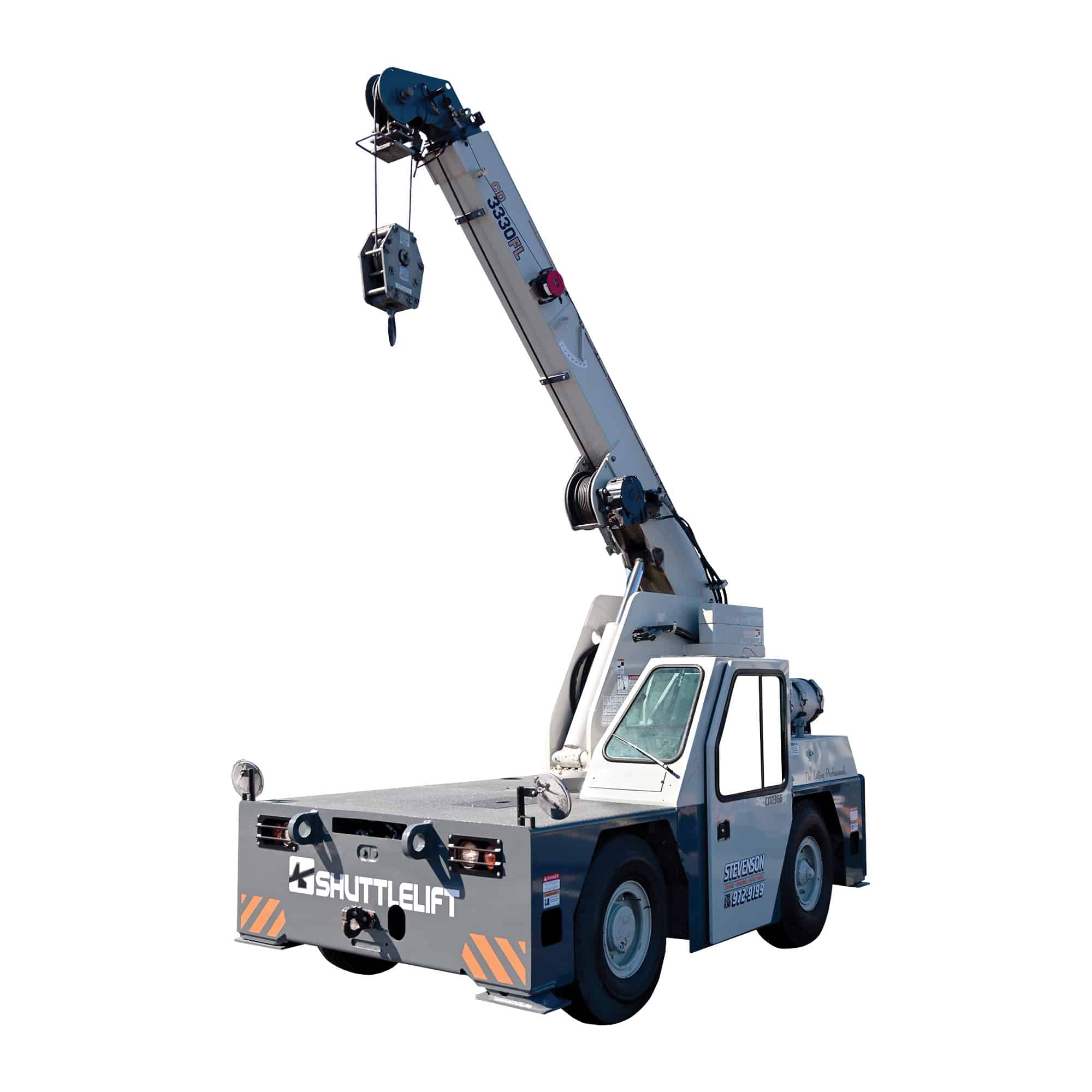 The image shows a Shuttlelift 3330FL carry deck crane. It features a white telescoping boom with a lifting hook, mounted on a wheeled chassis for mobility. The name "SHUTTLELIFT" is visible on the rear.
