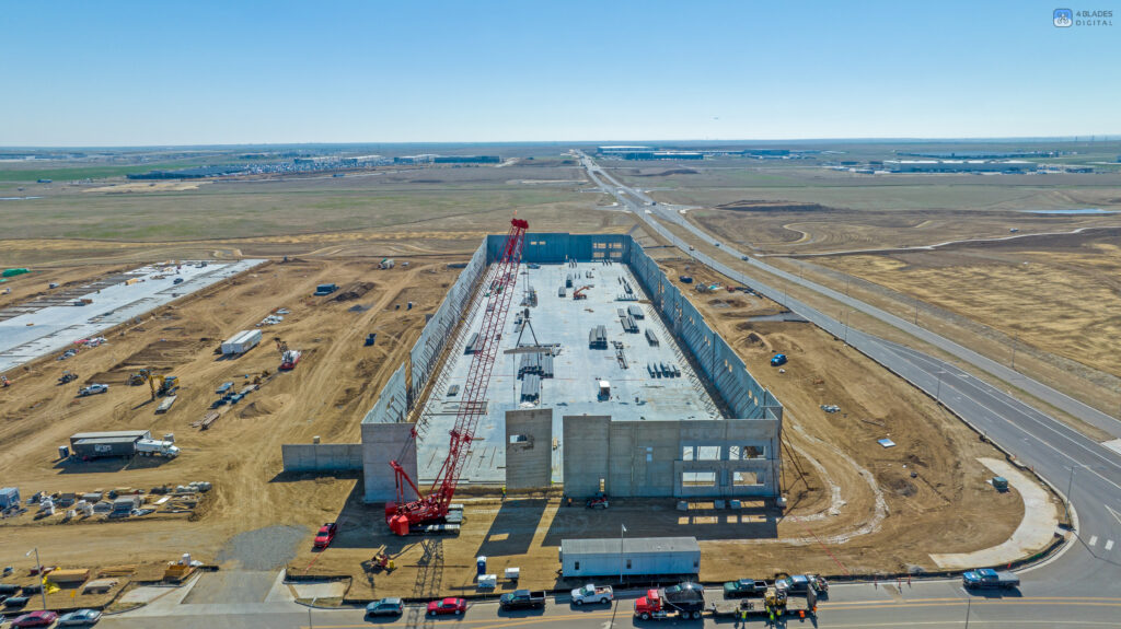 tilt-up construction crane placing panels