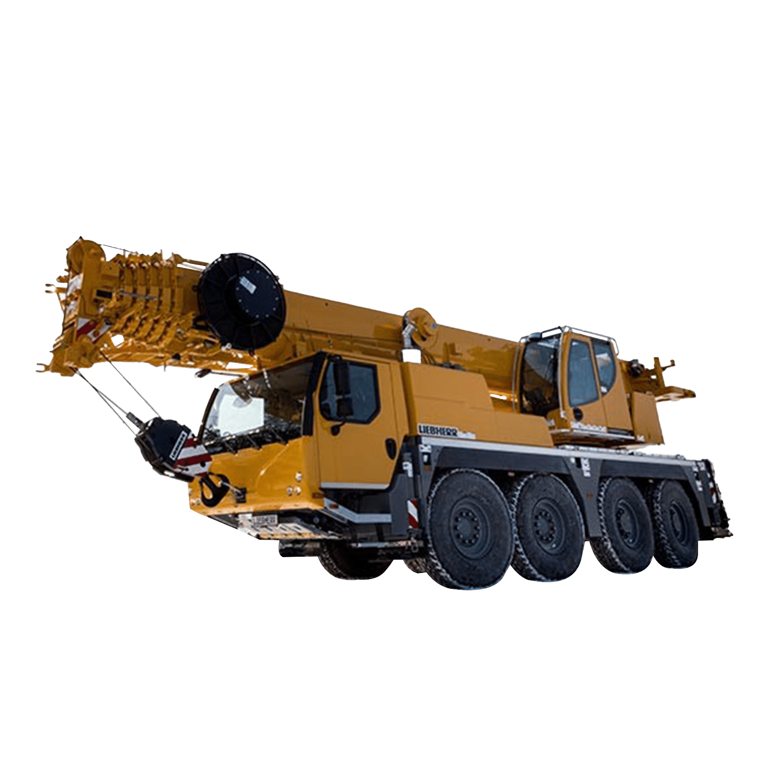 Liebherr crane in yellow, parked on snow, showcasing engineering in winter conditions.