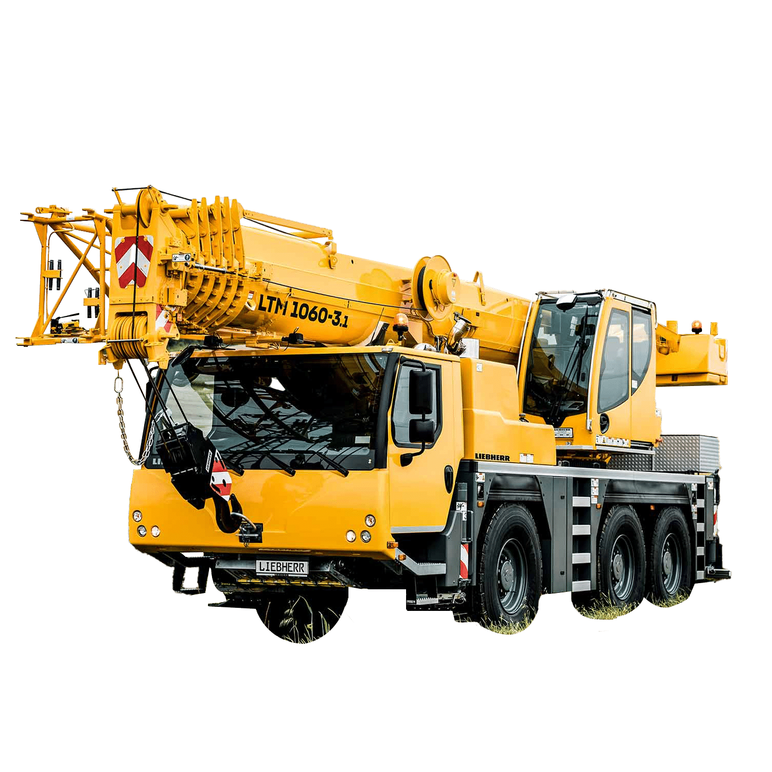 Yellow Liebherr LTM 1060-3.1 crane on a construction site, showcasing its robust design.