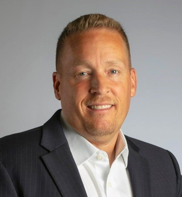 Professional business portrait of a confident man in a suit.