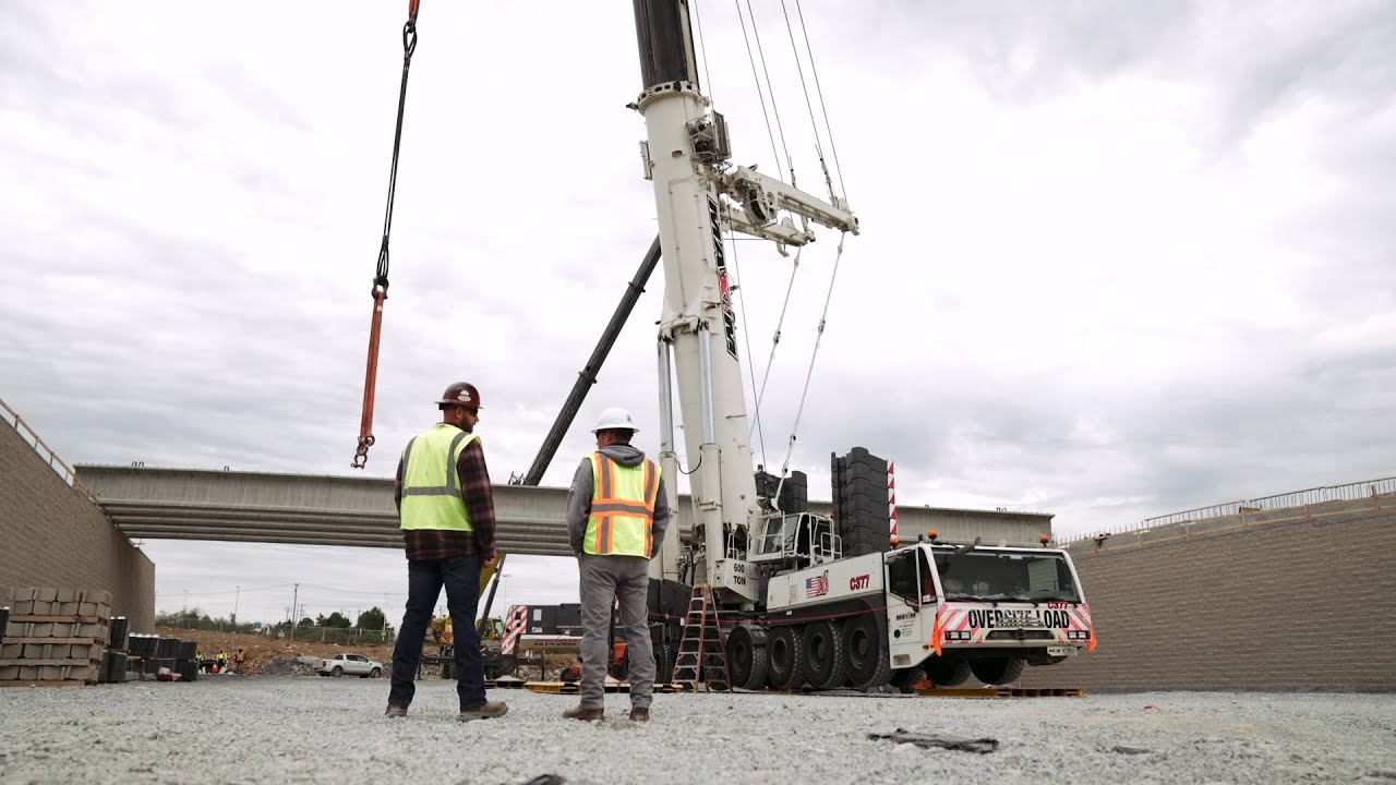 Crane operators coordinating at a construction site for heavy lifting projects.